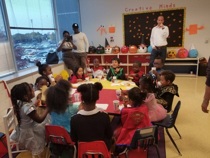 Kids are sitting at the table during the event in EarlyON Years Centre